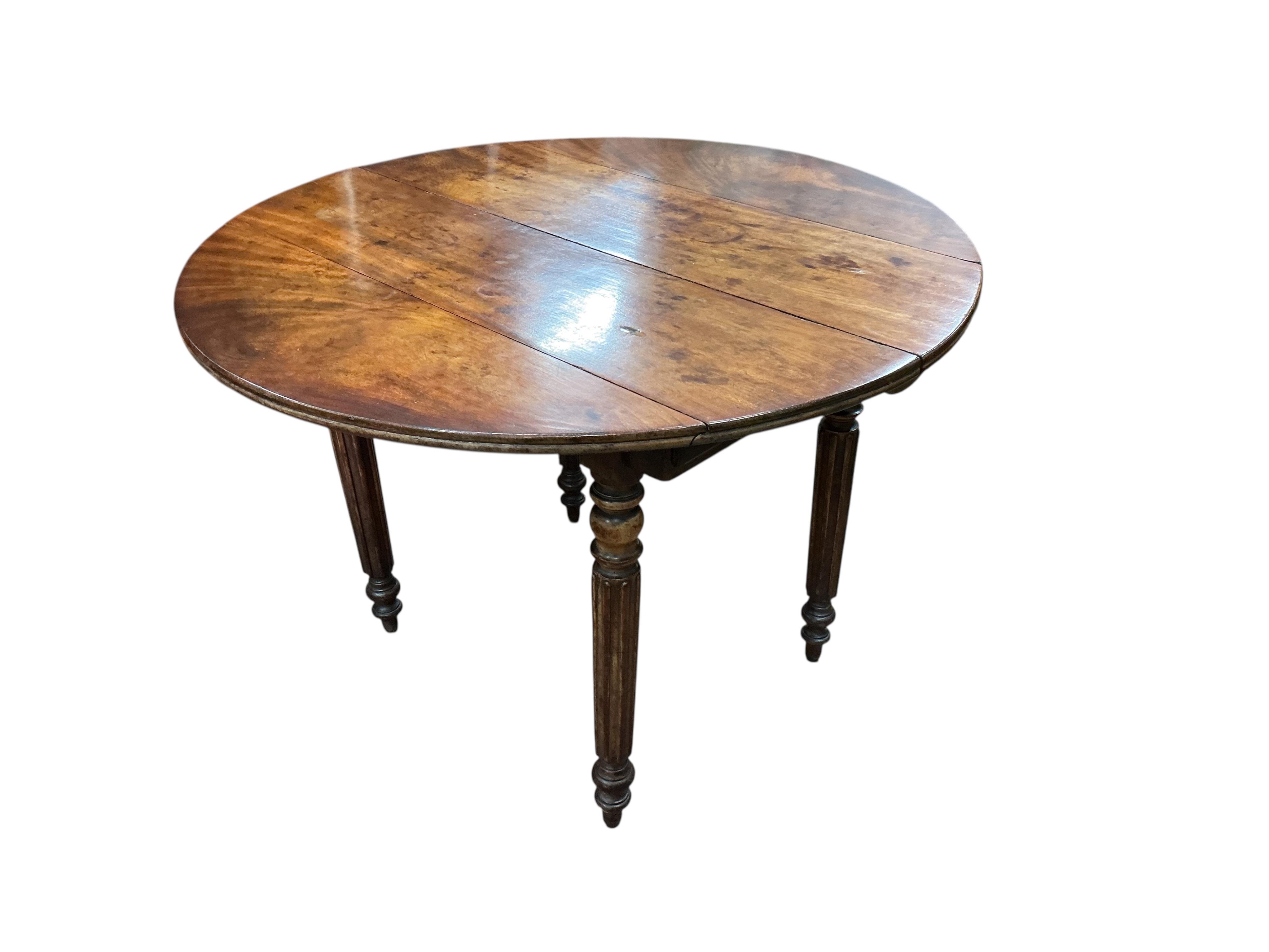 A 19th century French mahogany drop leaf extending dining table, 152cm extended, one spare leaf, depth 96cm, height 66cm